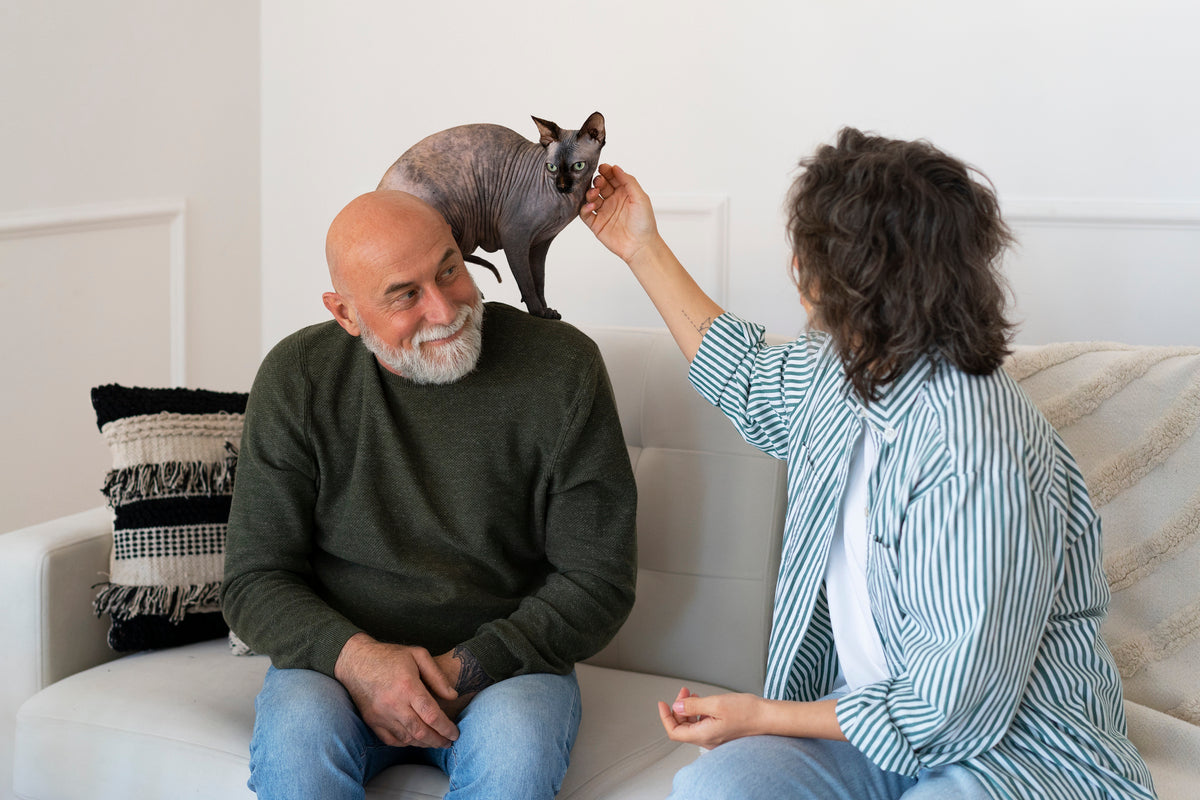 A pet psychic trying to hold the cat.